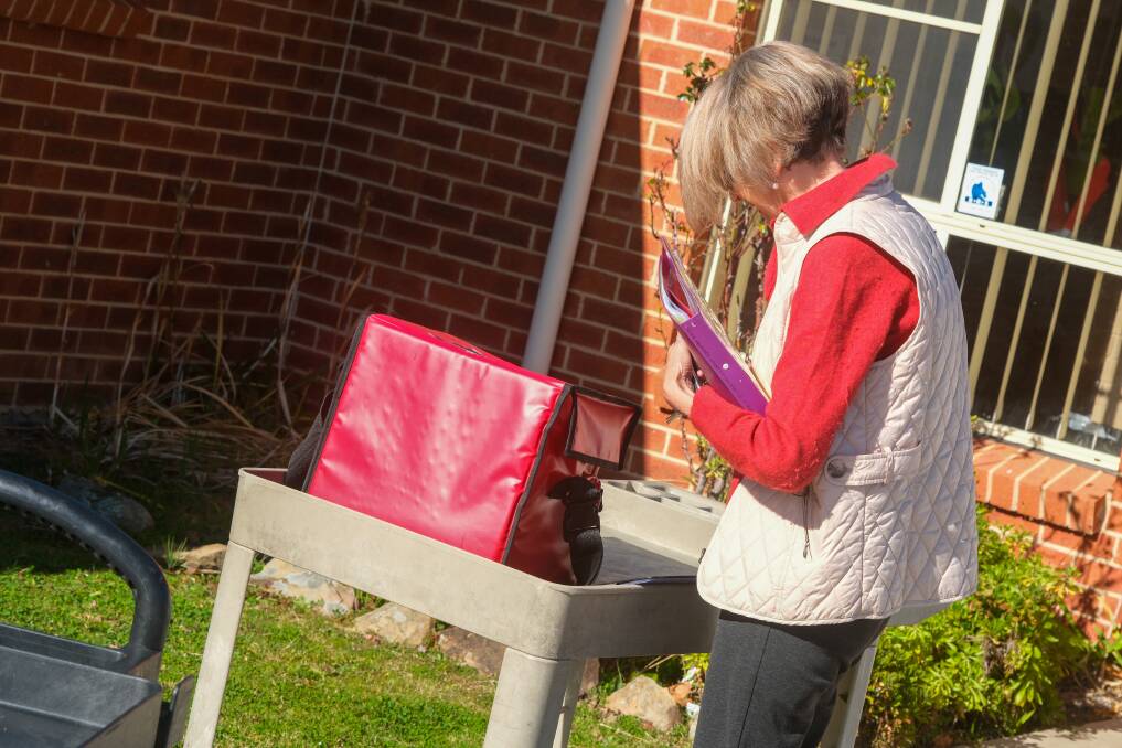 Meals on Wheels volunteer Jennifer Calvert assessing her delivery. Picture by James Arrow