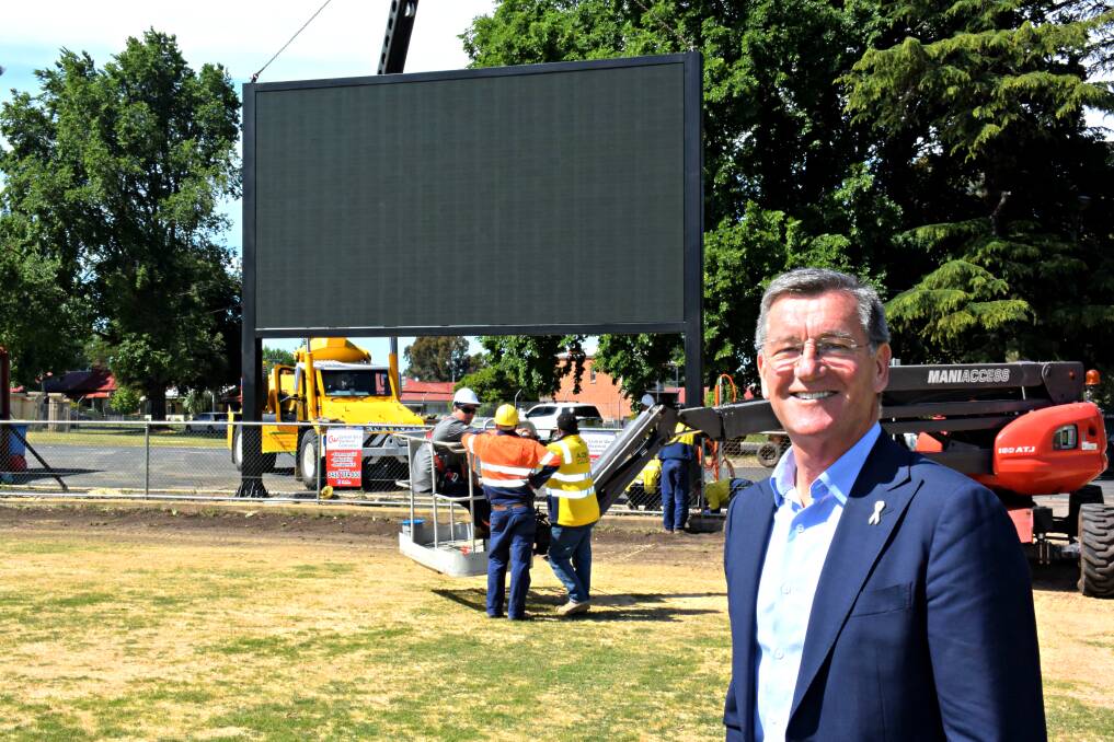GREAT: Mayor Gary Rush with the new $150,000 screen, that will boost the reputation of Carrington Park as a NRL playing field. Photo: RACHEL FERRETT 112516rfscreen2