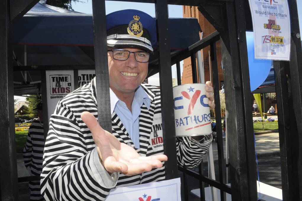 LOCKED UP: Bathurst Correctional Centre governor Mark Kennedy became an inmate during the PCYC's Time 4 Kids fundraiser. Photo: CHRIS SEABROOK 