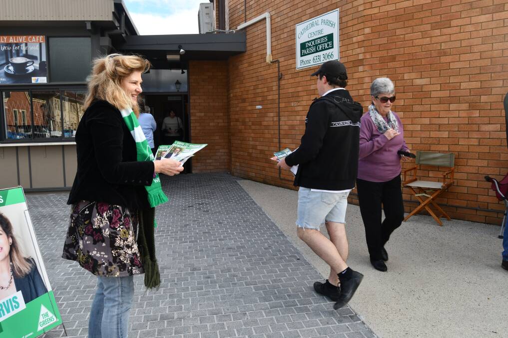 The Greens candidate Kay Nankervis handing out voting material at the Catholic Cathedral Parish Centre in Bathurst on Saturday. Photo: RACHEL CHAMBERLAIN