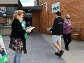 The Greens candidate Kay Nankervis handing out voting material at the Catholic Cathedral Parish Centre in Bathurst on Saturday. Photo: RACHEL CHAMBERLAIN