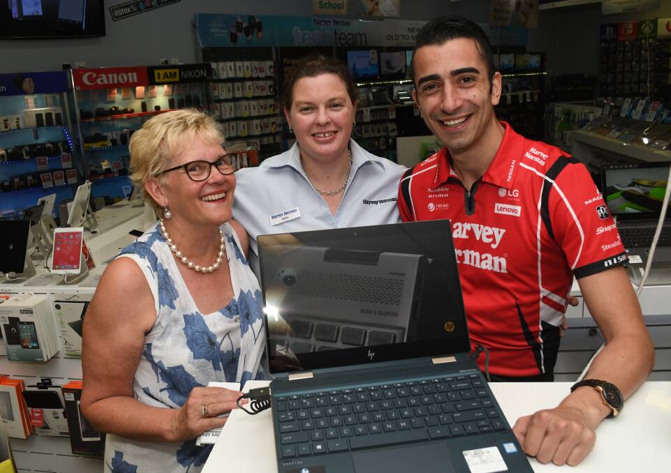 BIG SPENDER: The 2018 Festive Frenzy winner Jenny James with two of the Bathurst Harvey Norman franchisees, Abbie Miller and Sam Sultan, pictured in store. Photo: CHRIS SEABROOK 010919cfestwinr