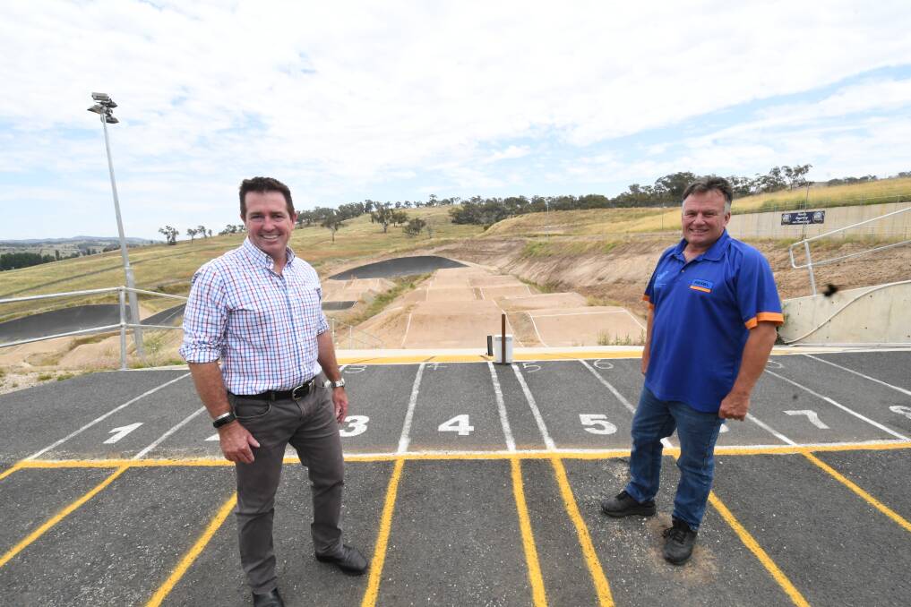 SUCCESSFUL PROJECT: Member for Bathurst Paul Toole and Bathurst BMX Club president Michael Breen at the start gate of the BMX track, where a permanent cover will be installed. Photo: CHRIS SEABROOK 010819cbmx