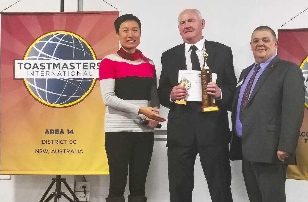 WINNERS: Bathurst Toastmasters Club members Miao Li and Merv Tobin on Sunday, with contest chairman Michael Said. Photo: SUPPLIED