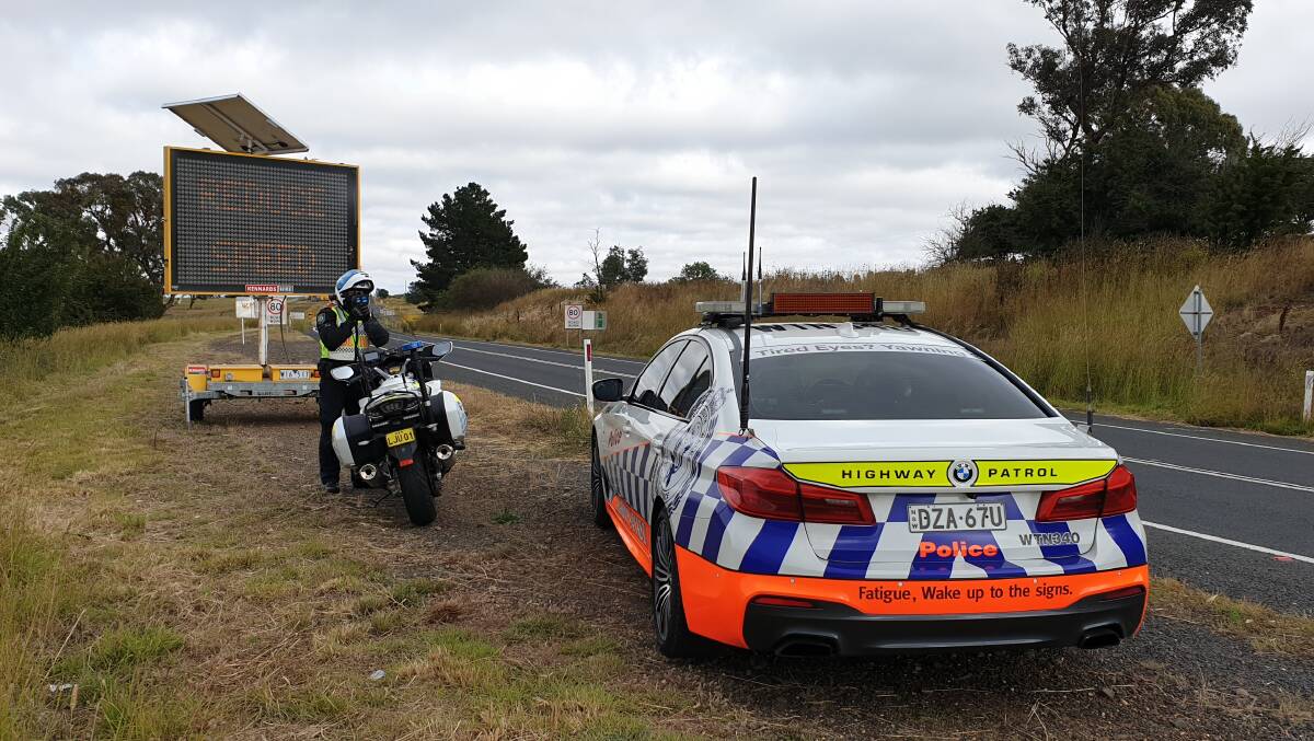 OUT IN FORCE: Senior Constable Jason Marks conducting speed enforcement in the road works zone of the Mitchell Highway, Guyong. Photo: SUPPLIED