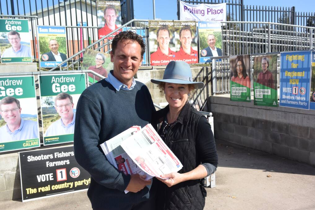 UNITED: Jess Jennings and his wife Kate after voting at Bathurst Public School this morning. 