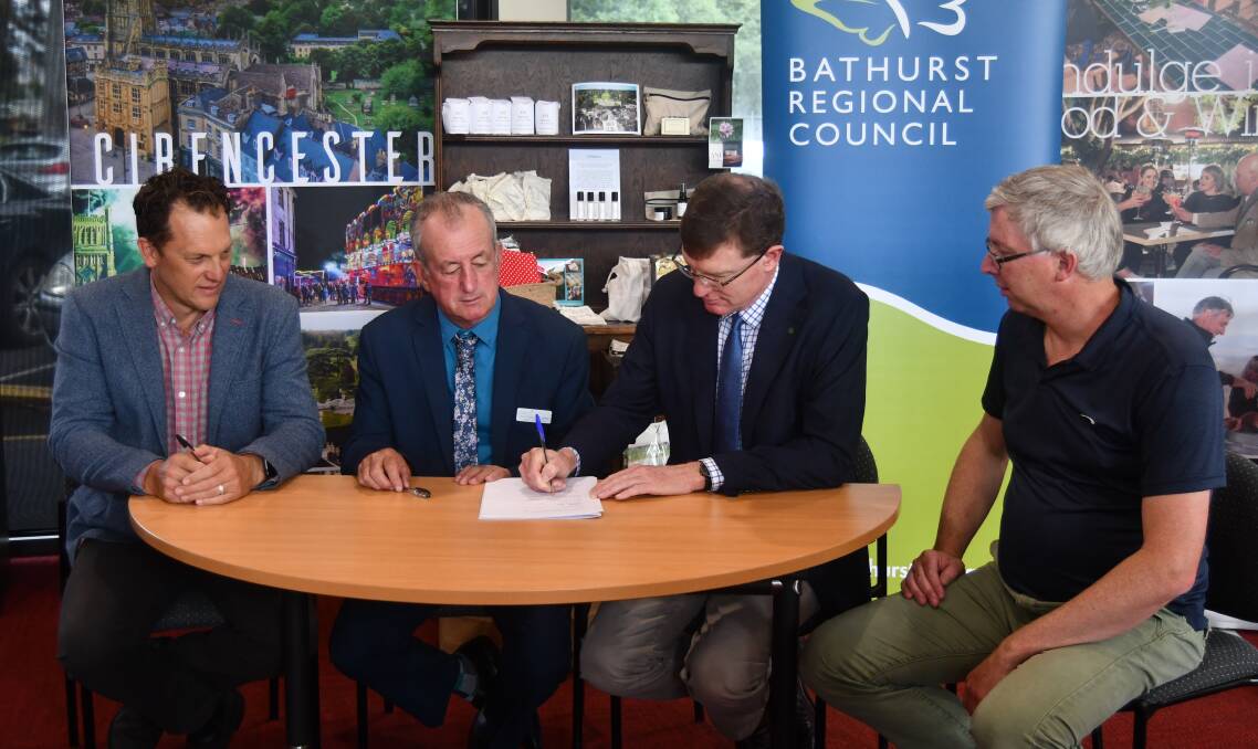 INKING A DEAL: Councillor Jess Jennings, mayor Bobby Bourke, member for Calare Andrew Gee and Bathurst Business Chamber's Angus Edwards. 