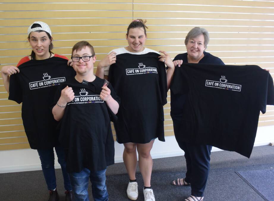 NEW CLOTHES: Vivability clients Jess Crawford, Jordon Zammitt and Mitch Smith with Fully Promoted owner Liz Luisi, holding their new shirts. 