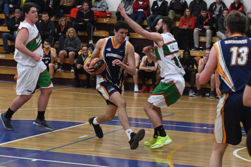 SNAPSHOT: Matthew Gray encounters a Moss Vale defender in his final match for the Bathurst Goldminers. Photo: CHRIS SEABROOK 052618cgoldmsnp