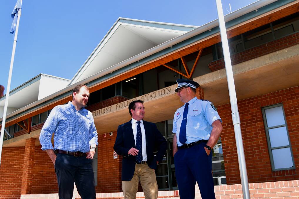 IMPORTANT MESSAGE: Minister for Regional Transport Sam Farraway, deputy premier Paul Toole and acting Superintendent Bruce Grassick outside Bathurst Police Station on Christmas Eve. Photo: RACHEL CHAMBERLAIN