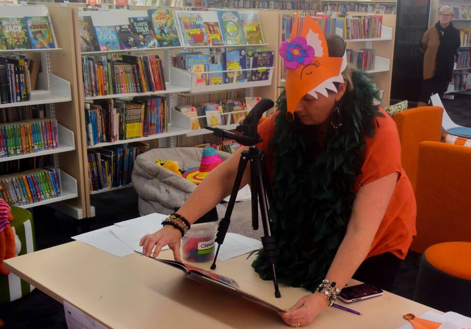 SOMETHING DIFFERENT: Bathurst Library staff member Rhiannon Mijovic reading the book to the Facebook live audience on Wednesday.
