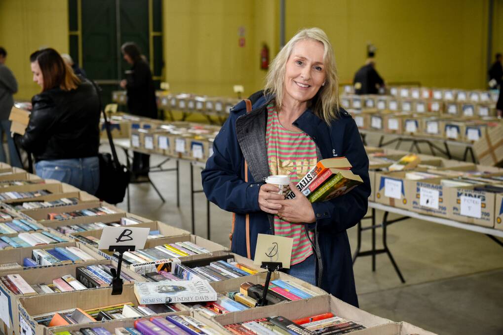 Lifeline Central West chief executive officer Stephanie Robinson holding books at the Lifeline Book Fair. Picture by James Arrow