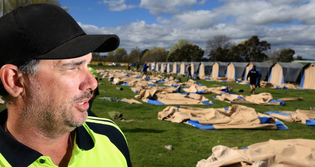 MOVING: Tent City owner Shawn Whitmore is working to relocate more than 300 tents to Alec Lamberton Field before race week campers arrive. Photo: PHIL BLATCH 092616pbtent2