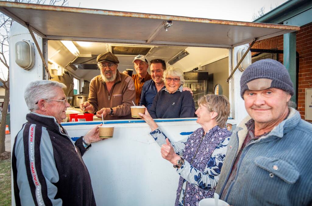 GOING STRONG: Mayor Bobby Bourke (back) said the op shop's food van is thriving with the help of volunteers and supporters, including member for Bathurst Paul Toole. Photo: SUPPLIED 