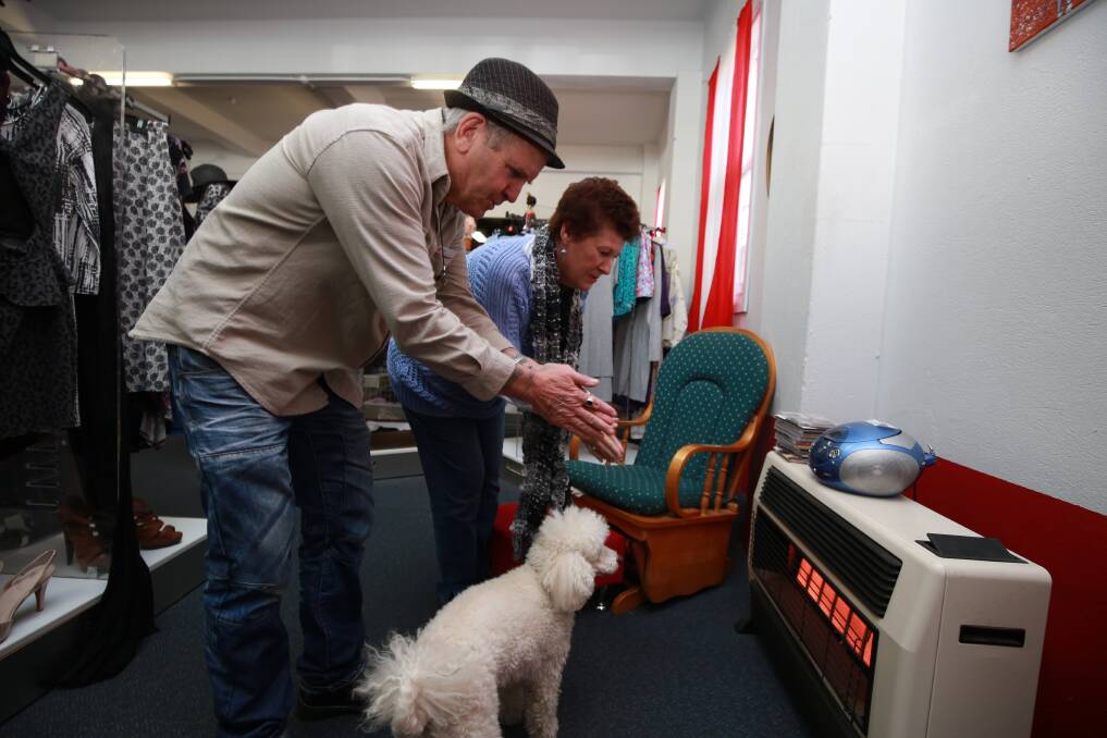 COLD TIMES: Manager Steve Barrott, volunteer Gaye McClure and Bob the poodle feeling the chill in the Salvation Army Family Store this week. Photo: PHIL BLATCH 050819pbsalvo1