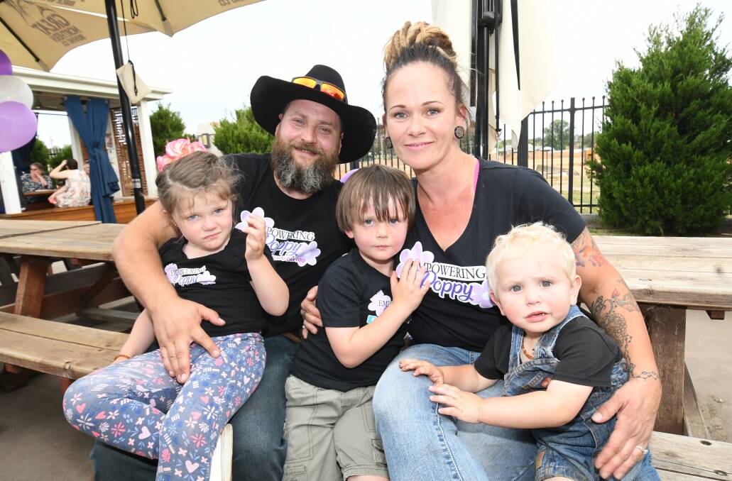 HAPPY: Michael and Courtney Stanton with their kids Poppy, Patrick and Buddy at Paddy's Hotel on Saturday. Photo:CHRIS SEABROOK 110219cpoppy