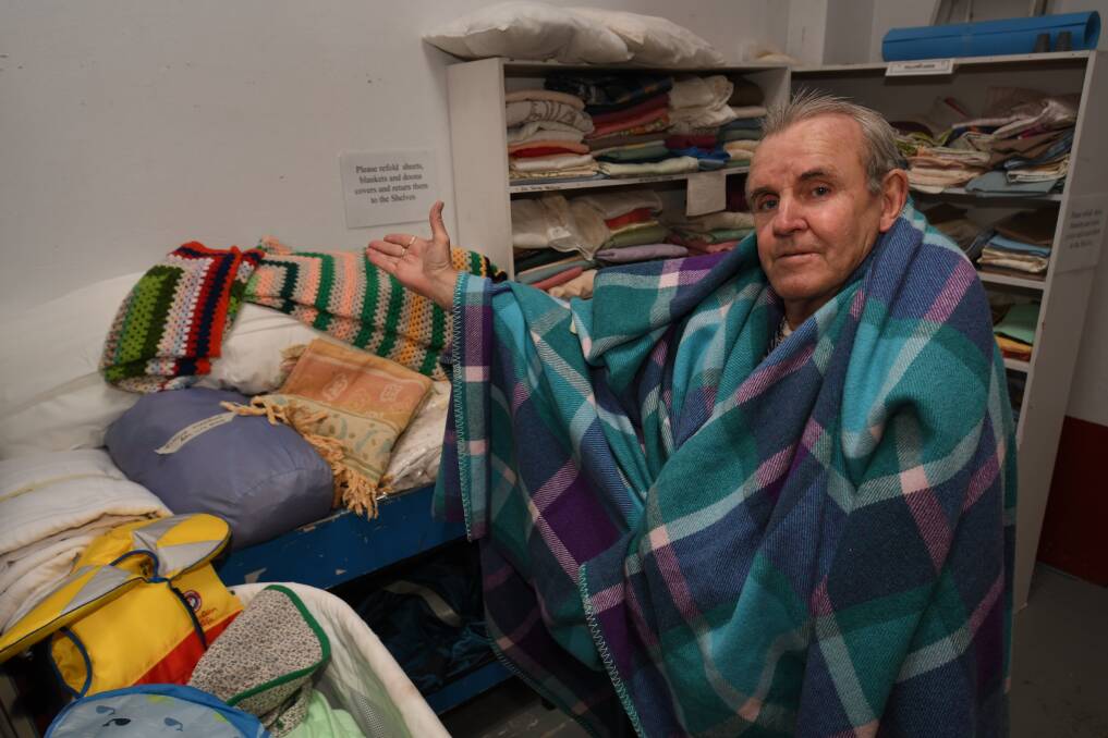 BARELY THERE: Salvation Army Family Store manager Stephen Barrott showing the limited supply of blankets the store has available. Photo: CHRIS SEABROOK 051518csalovos