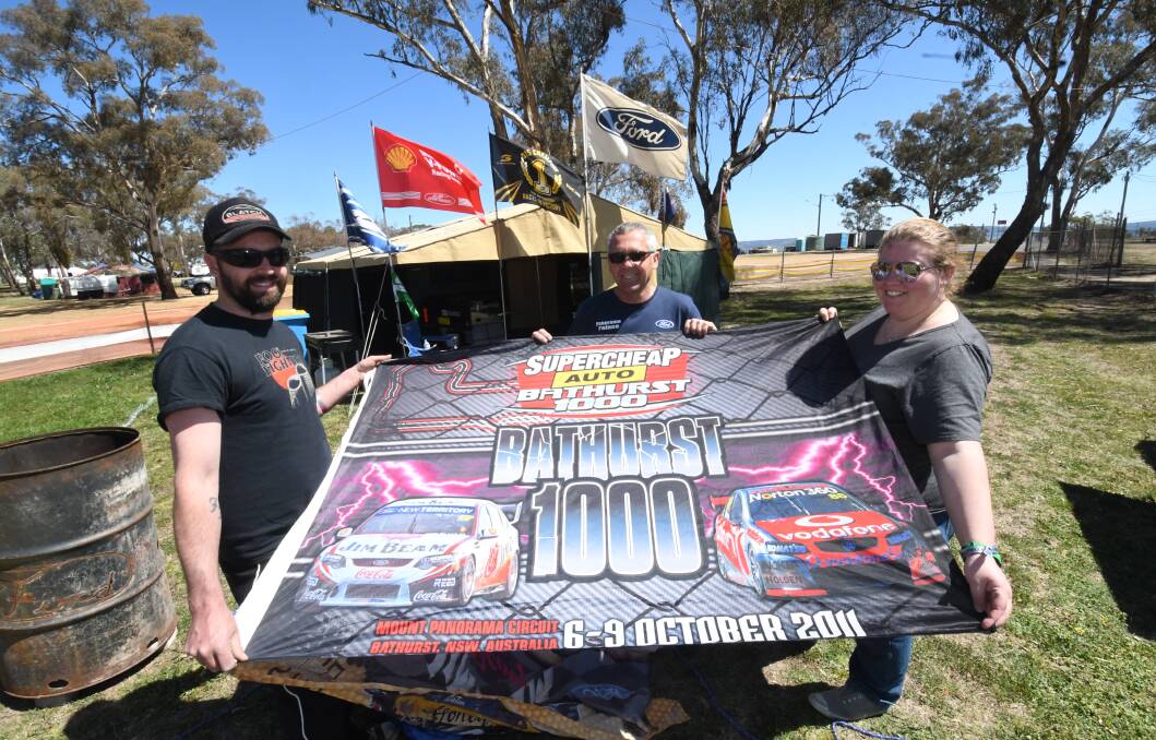 FAMILY TRADITION: This year is the 50th time that Ian Watson (centre) has camped at Mount Panorama. Meanwhile, Tim Watson and Emily Hanson have camped there 27 and three times respectively. Photo: CHRIS SEABROOK 093018cfans1