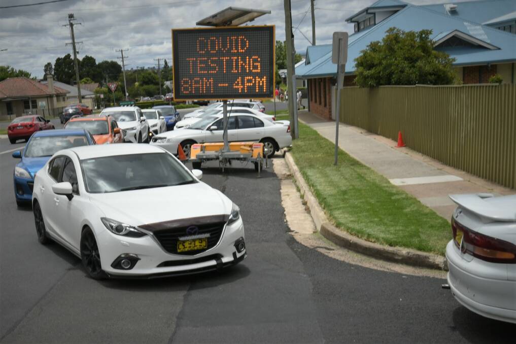LONG LINE: The queue for testing regularly goes beyond the Bathurst RSL car park and into several CBD streets. Photo: CHRIS SEABROOK 