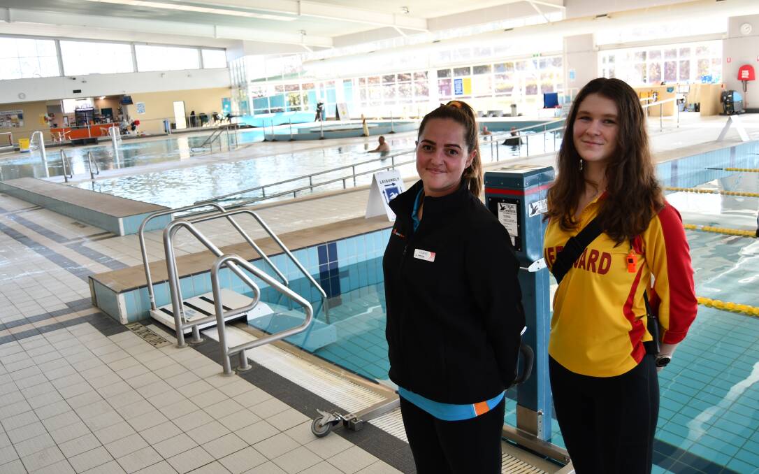 Manning Aquatic Centre Bathurst's inclusion coordinator Rowee Stair and lifeguard Kathryn van Klooster with the accessibility equipment. Photo: RACHEL CHAMBERLAIN