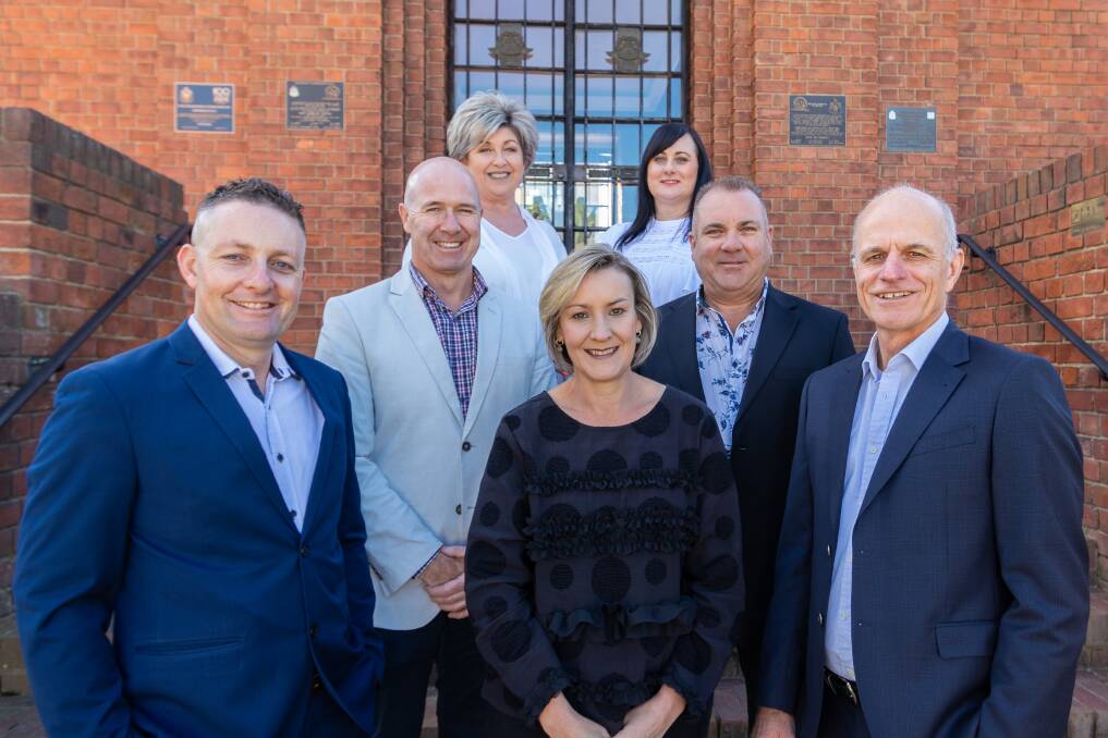 SUCCESS: Raine and Horne Bathurst directors Grant Maskill-Dowton, Michelle Mackay and Matt Clifton, with the sales team. Photo: SUPPLIED