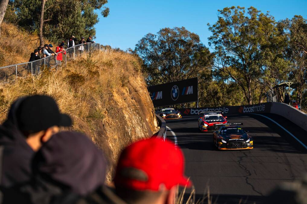Spectators watching cars coming down Mount Panorama during the Bathurst 12 Hour. Picture by EDGE Photographics