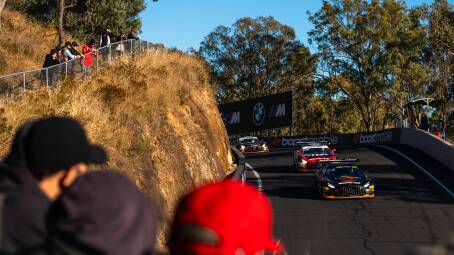 Spectators watching cars coming down Mount Panorama during the Bathurst 12 Hour. Picture by EDGE Photographics