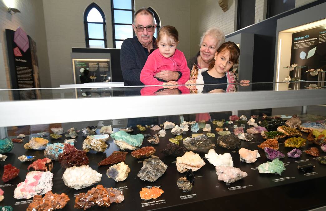FUN: John and Christine Parish, from Sydney, looking at the minerals with grandchildren Veronica and Danika, from Bathurst. Photo: CHRIS SEABROOK 061019crocks