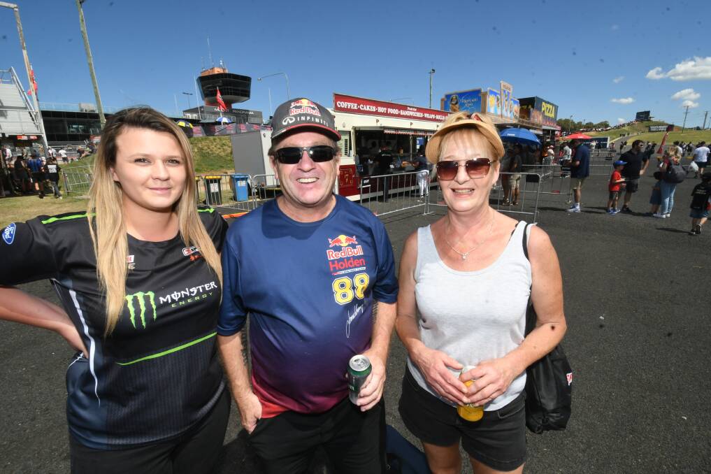 RACE FANS: Sophie Couling (Oberon), Tim Connell (Cessnock), and Marianne Stockdale (Bathurst) at the track on Sunday. Photo: CHRIS SEABROOK