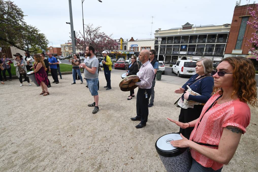 FLASH MOB: People with drums were part of a flash mob in Kings Parade on Tuesday afternoon. Photo: CHRIS SEABROOK 100918cflshmob1