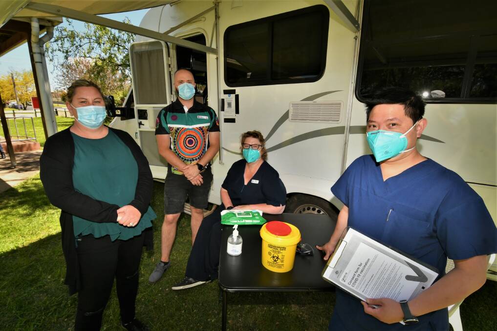 READY TO HELP: Bathurst Local Aboriginal Land Council CEO Toni-Lee Scott, Mat Barnes from Aboriginal Health, registered nurse Polly Slade and vaccination team leader Juff Mou. Photo: CHRIS SEABROOK 101821cmobilvax