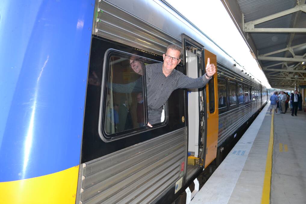 MILESTONE: John Hollis, pictured on the maiden Bathurst Bullet journey in 2012, said he is happy that the train service has been on the railway lines for six years. 