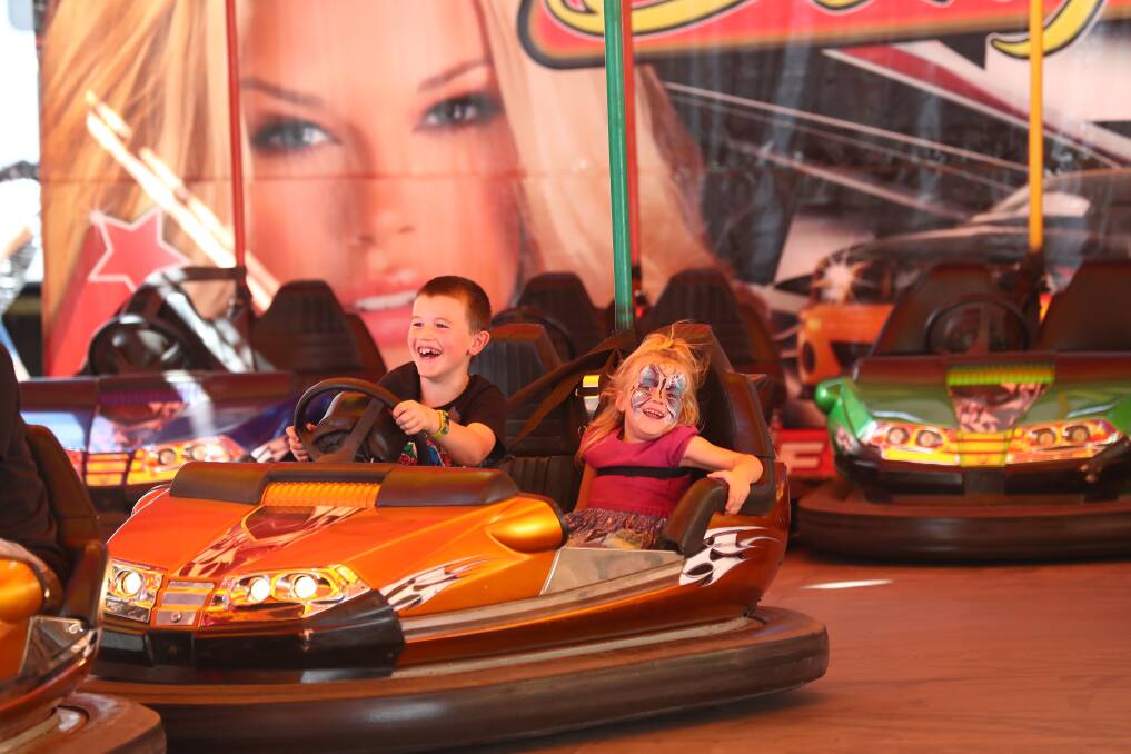 FILE PHOTO: These children enjoyed whizzing around in a dodgem car at last year's Royal Bathurst Show. Photo: PHIL BLATCH