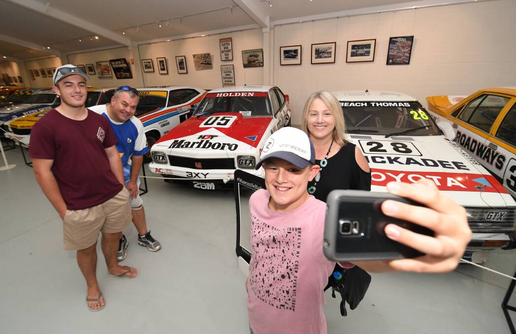 SMILE: Liam Deegan taking a selfie at the motor racing museum with Ryan, Martin and Amanda Deegan. Photo: CHRIS SEABROOK 011619cselfie1