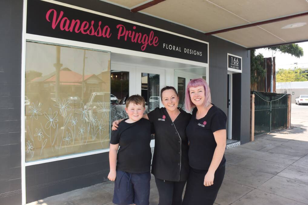 FRESH LOOK: Vanessa Pringle (centre) with her son Charlie, 10, and florist Anna Smith outside the new building in William Street, where Vanessa Pringle Floral Designs will move to in January. Photo: RACHEL CHAMBERLAIN 121919rcfloral
