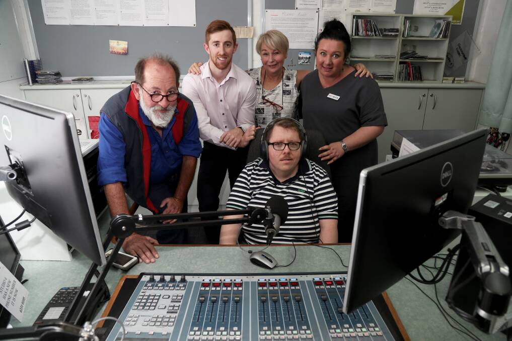 SUPPORT NETWORK: Andrew Campbell with 2MCE station president Mark Ryan, Vivability's Blake Aubin, carer Petra Robinson and Vivability's community access manager Ruth Thurtell. Photo: PHIL BLATCH 032018pbmce1