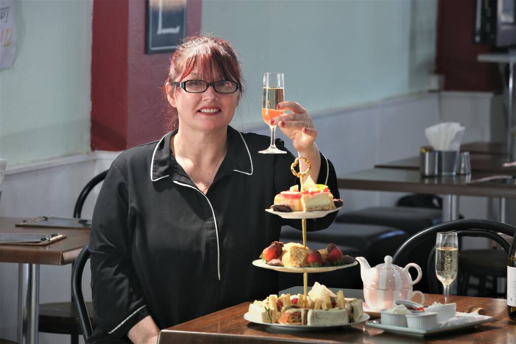 NEW OFFERING: One of the owners of Nikki's Café on William, Nikki Calabro, sitting down to high tea. Photo: PHIL BLATCH 030921pbtea1