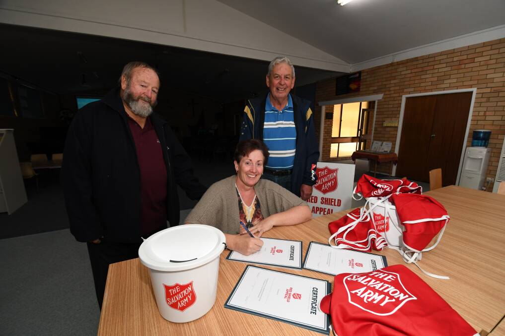 THANKS FOR THE SUPPORT: Ron Hollebone, Penny Williams and Kevin Howard, who all helped with the Red Shield Appeal in Bathurst over the weekend. Photo: CHRIS SEABROOK 052918csalvos