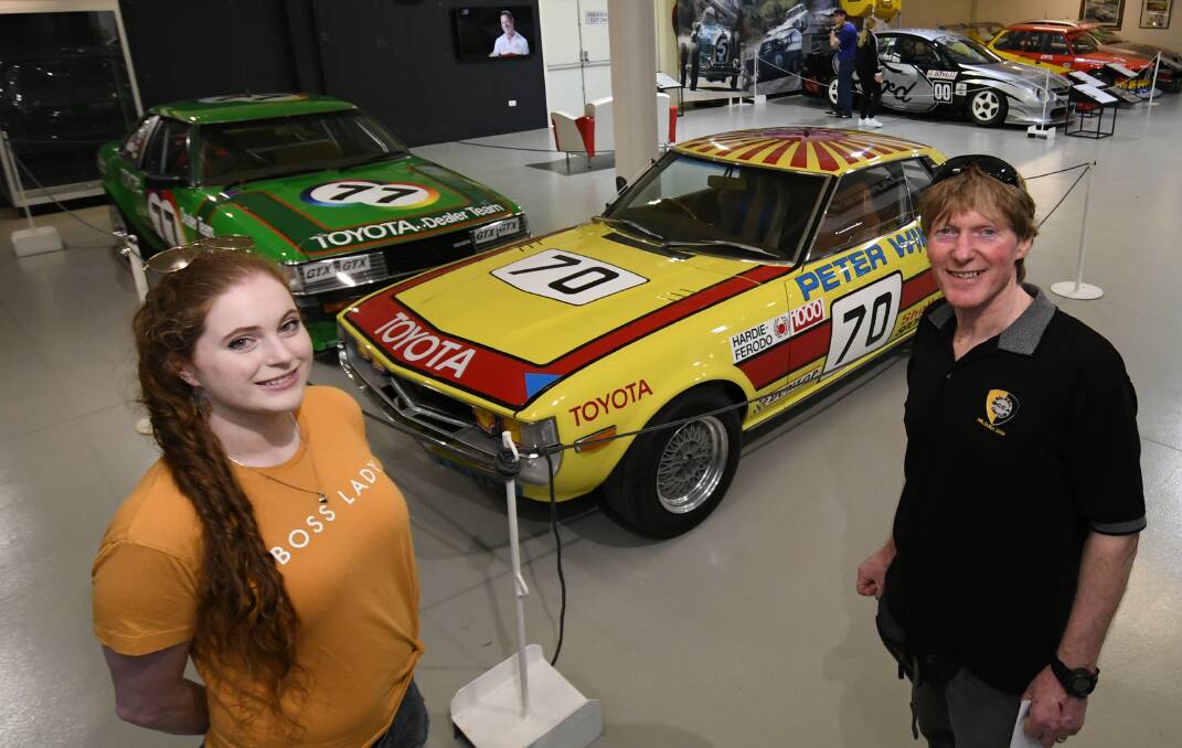 CELICA FANS: Bronte and Murray Kenny went to the motor racing museum after driving up to Bathurst from Pakenham, Victoria. Photo: CHRIS SEABROOK 090119cmtp2