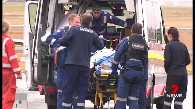 ASSISTANCE: Paramedics helping the teenager on Sunday. Photo: SEVEN NEWS