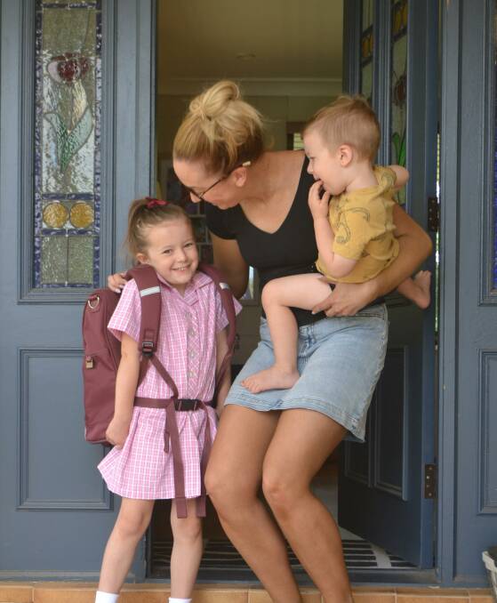 TECH FREE: Sophie Fenwick, with her mother Rachel and brother Harrison, is set for school, minus any smart devices. Photo: Andrew Lotherington