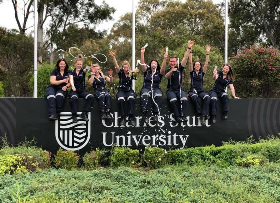 CHEERS: Paramedic students will still celebrate their graduation despite not CSU not hosting traditional ceremonies this year. Photo: SUPPLIED
