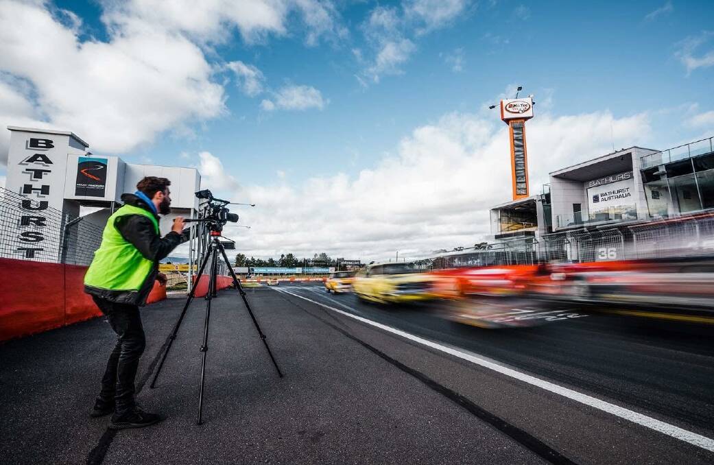 Hands on: Ribbon Gang co-founder and creative director, David Ten Broeke, getting a taste of the action while filming some amazing shots for the National Motor Racing Museum. Photo: Supplied.