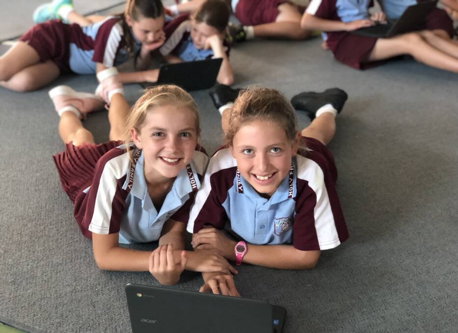 Keeping one step ahead: Holy Family students take their learning into the future as they complete some digital learning 'coding' tasks. Photo: Supplied.