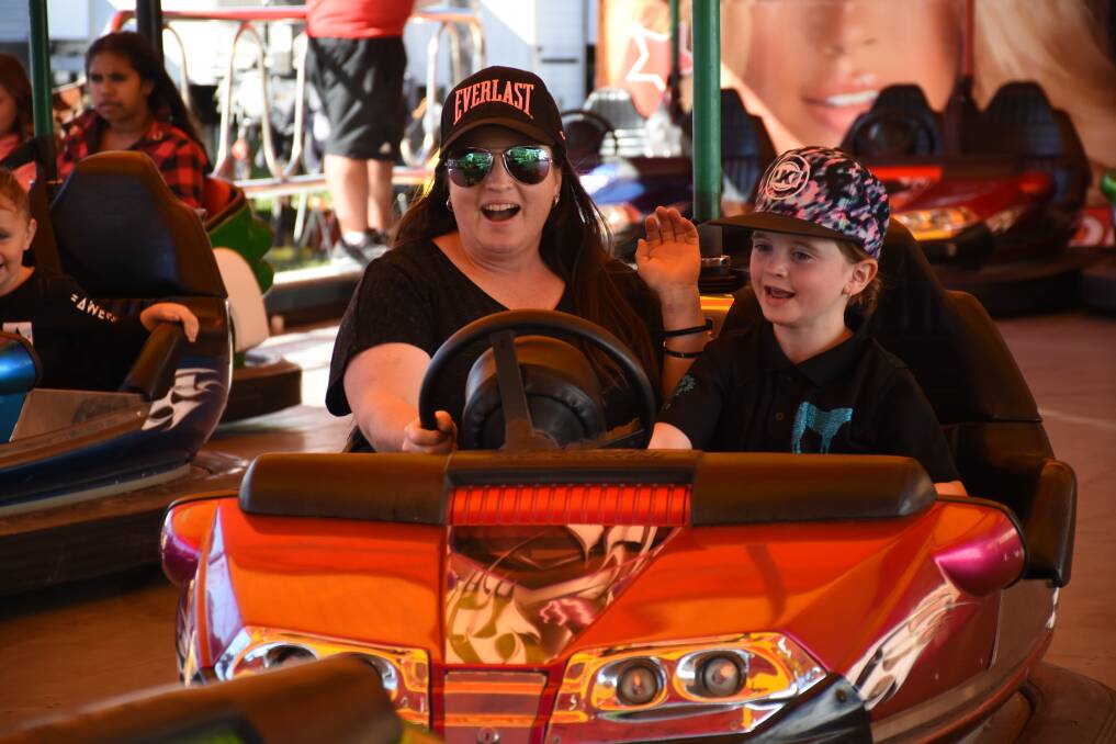 Fun for all: As Chris Monk and daughter Ashley can attest, the dodgem cars offer fun for everyone young and old, big and small. Photo: Nadine Morton.