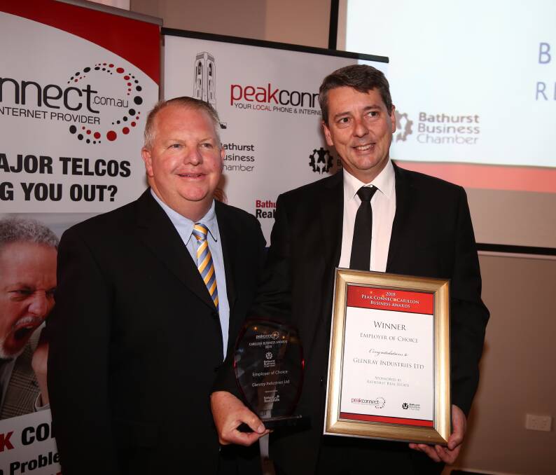 Best in the business: Michael Whittaker presents Glenray's Manager of People & Culture, Craig Sheil, with the Employer of Choice Award. Photo: Phil Blatch.