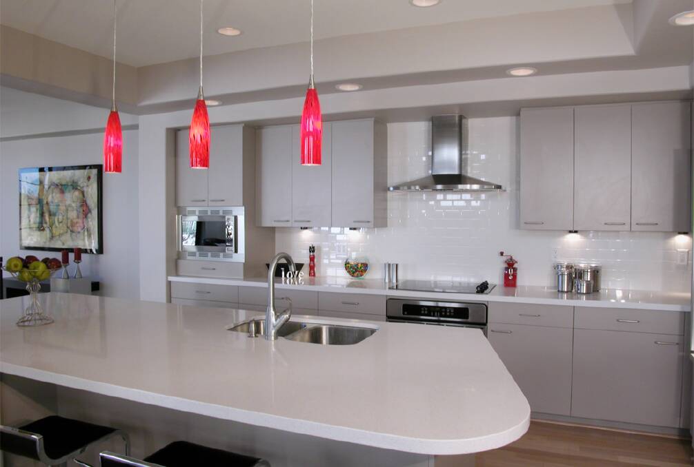 The ideal way to place pendant lights in a kitchen is in a group of three. Picture: Supplied