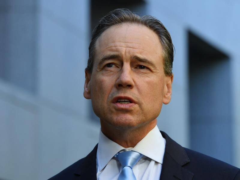 Health Minister Greg Hunt says the world outside Australia is not "safe" as COVID-19 cases soar.