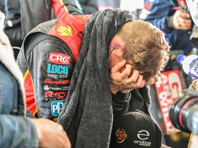 David Reynolds with his head in his hands after leg cramps cost him another Bathurst title.