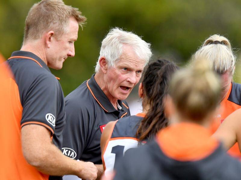 GWS's No.1 employee Alan McConnell (c) has endured a long road with the Giants.
